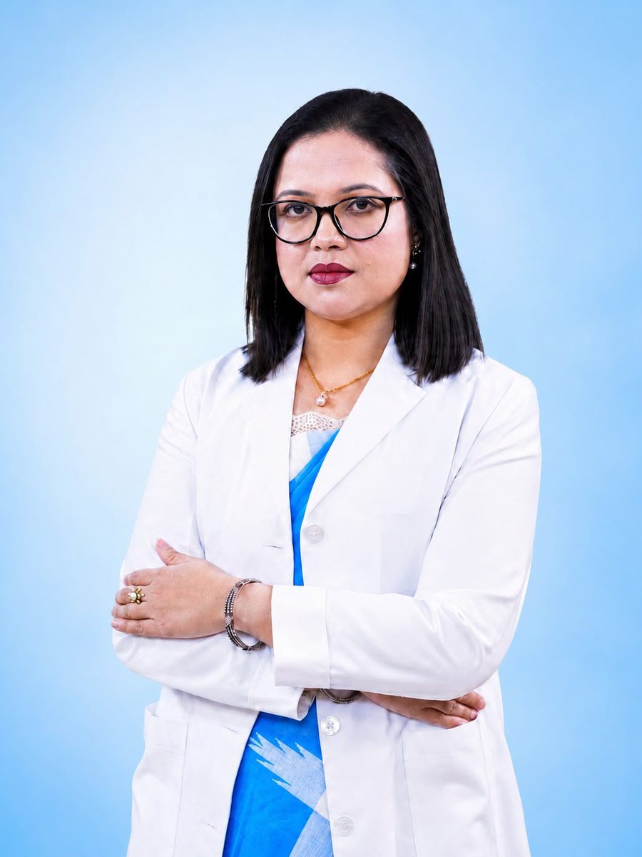 Dr. Sifat-E-Aman in a white doctor's coat over a blue sari, arms folded, against a light blue background.